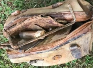 Boy calls the police after fishing an old bag out of the water and looking inside